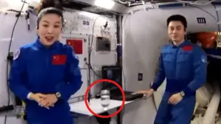 Astronautas chinos realizando experimentos en la estación espacial china