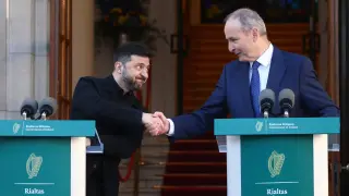 Ukraine President Volodymyr Zelenskyy, left, shakes hands with the Irish Prime Minister Micheal Martin as they hold a joint press conference in Dublin, Ireland, Tuesday, Dec. 2, 2025. (AP Photo/Peter Morrison)
