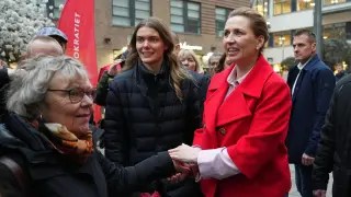 Danish Prime Minister and Leader of the Social Democrats Mette Frederiksen shakes hands with citizens in Copenhagen, Denmark, on Tuesday, March 24, 2026, during the general election. (AP Photo/Sergei Grits)