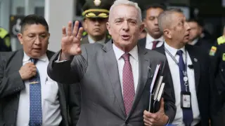 FILE - Former President Alvaro Uribe leaves court after a hearing in his trial over witness tampering and bribery charges in Bogota, Colombia, Feb. 10, 2025. (AP Photo/Fernando Vergara, File)
