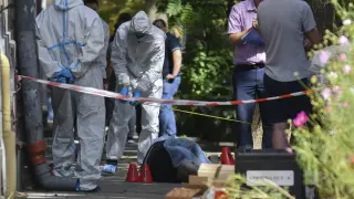 Forenses en la escena del asesinato de Andri Parubi.