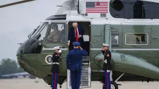 President Donald Trump disembarks Marine One, Sunday, Sept. 21, 2025, at Joint Base Andrews, Md. (AP Photo/Julia Demaree Nikhinson)