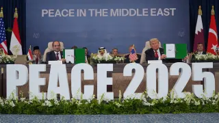 President Donald Trump and Egypt's President Abdel-Fattah el-Sissi hold signed documents during a summit to support ending the more than two-year Israel-Hamas war in Gaza after a breakthrough ceasefire deal, Monday, Oct. 13, 2025, in Sharm El Sheikh, Egypt. (AP Photo/Evan Vucci)