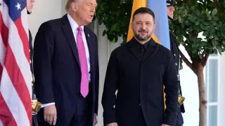 President Donald Trump, left, greets Ukraine's President Volodymyr Zelenskyy at the White House, Friday, Oct. 17, 2025, in Washington. (AP Photo/Alex Brandon)