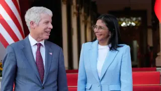 Venezuela's acting President Delcy Rodriguez bids farewell to U.S. Energy Secretary Chris Wright after their meeting at Miraflores Palace in Caracas, Venezuela, Wednesday, Feb. 11, 2026. (AP Photo/Ariana Cubillos)