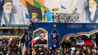 TEHRAN, IRAN - MARCH 18: Caskets are transported during a joint funeral held for Ali Larijani, Secretary of Iran's Supreme National Security Council, Basij commander Major General Gholam Soleimani, and 84 sailors from the Iranian Navy frigate IRIS Dena, on March 18, 2026 in Tehran, Iran. Larijani and Gholamreza, two of the highest-ranking Iranian officials to be assassinated since the outbreak of the war on February 28, were killed in US-Israeli airstrikes on March 17, according to Iranian state media. The 84 sailors were killed when the IRIS Dena was sunk in a torpedo strike by the USSCharlotte, an American submarine,off the coast of Sri Lanka on March 4. (Photo by Majid Saeedi/Getty Images)