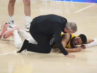 Indiana Pacers guard Tyrese Haliburton lays on the court after an injury during the first half of Game 7 of the NBA Finals basketball series against the Oklahoma City Thunder Sunday, June 22, 2025, in Oklahoma City. (AP Photo/Nate Billings)