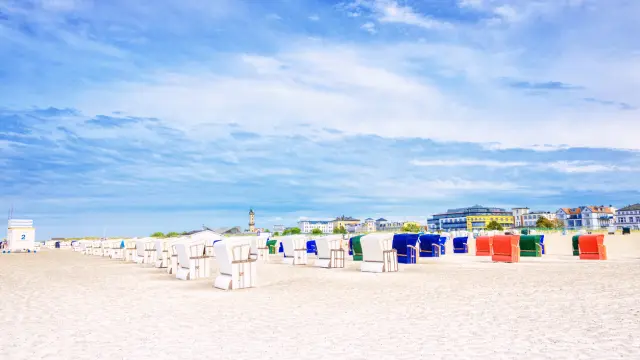 Hooded Beach Chair scenery at the famous German Beach Resort town Warnemünde, Rostock at the Baltic Sea.