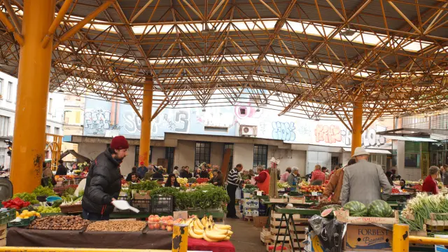 Sarajevo, Bosnia and Herzegovina - June 1st, 2013: Morning fruit & vegetable shopping at Markale central market of Sarajevo. Vendors just started to sell.