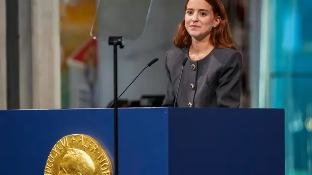 The daughter of the Nobel Peace Prize laureate, Ana Corina Sosa, accepts the award on behalf of her mother, Venezuelan opposition leader Maria Corina Machado, during the Nobel Peace Prize ceremony at Oslo City Hall, Norway, Wednesday Dec. 10, 2025. (Ole Berg-Rusten/NTB Scanpix, Pool via AP)