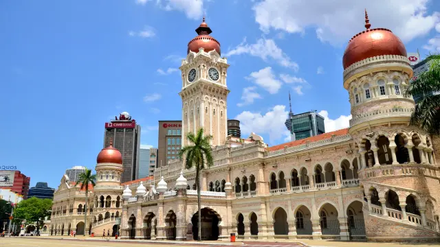 Kuala Lumpur,Malaysia - February 16, 2014: The tourists can seen walking around the Sultan Abdul Samad building is located in front of the Merdeka Square in Jalan Raja,Kuala Lumpur Malaysia.