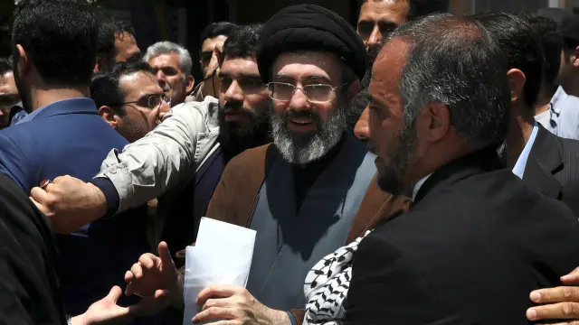FILE - Mojtaba Khamenei, the son of Iranian Supreme Leader Ayatollah Ali Khamenei, center, attends the annual Quds, or Jerusalem Day rally in Tehran, Iran, on May 31, 2019. (AP Photo/Vahid Salemi, File)
