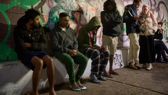 People take shelter in an Underground tunnel as air raid sirens signal a warning of incoming Iranian missiles in Jerusalem, Thursday, March 19, 2026. (AP Photo/Ohad Zwigenberg)