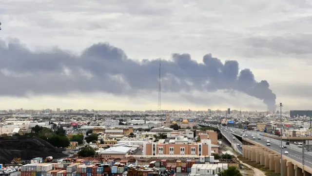 Smoke rises from Kuwait international airport after a drone strike on fuel storage in Kuwait City, Kuwait, Friday, Wednesday, March 25, 2026. (AP Photo)