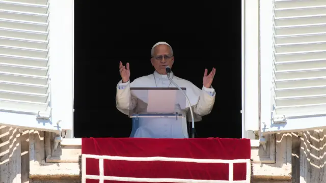 Pope Leo XIV delivers his blessing as he recites the Regina Coeli noon prayer from the window of his studio overlooking St.Peter's Square, at the Vatican, Monday, April 6, 2026. (AP Photo/Andrew Medichini)