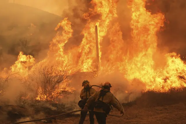 Firefighters battle the Canyon Fire on Thursday, Aug. 7, 2025, in Hasley Canyon, Calif. (AP Photo/Marcio Jose Sanchez)