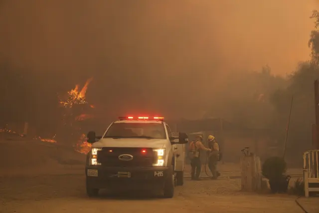 Firefighters battle the Canyon Fire on Thursday, Aug. 7, 2025, in Hasley Canyon, Calif. (AP Photo/Marcio Jose Sanchez)