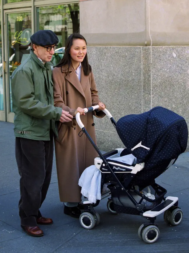 Woody Allen & wife, Soon Yi Previn stoell on Madison Avenue with their newly adopted daughter, Bechet Dumaine Allen, suprising photographers and world wide media on April 24, 1999. Allen would only confirm she is a few months old. This photo ran as the cover of the New York Post on April 25, 1999. photo by Lawrence Schwartzwald
