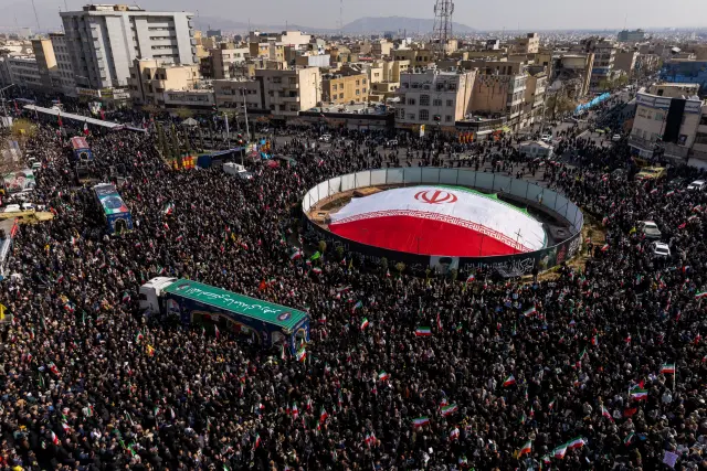 TEHRAN, IRAN - MARCH 18: Large crowds gather during a joint funeral held for Ali Larijani, Secretary of Iran's Supreme National Security Council, Basij commander Major General Gholam Soleimani, and 84 sailors from the Iranian Navy frigate IRIS Dena, on March 18, 2026 in Tehran, Iran. Larijani and Gholamreza, two of the highest-ranking Iranian officials to be assassinated since the outbreak of the war on February 28, were killed in US-Israeli airstrikes on March 17, according to Iranian state media. The 84 sailors were killed when the IRIS Dena was sunk in a torpedo strike by the USSCharlotte, an American submarine,off the coast of Sri Lanka on March 4. (Photo by Majid Saeedi/Getty Images)