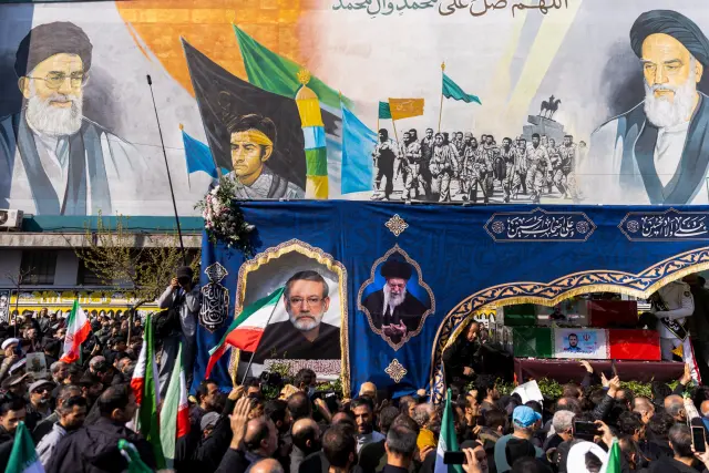 TEHRAN, IRAN - MARCH 18: Caskets are transported during a joint funeral held for Ali Larijani, Secretary of Iran's Supreme National Security Council, Basij commander Major General Gholam Soleimani, and 84 sailors from the Iranian Navy frigate IRIS Dena, on March 18, 2026 in Tehran, Iran. Larijani and Gholamreza, two of the highest-ranking Iranian officials to be assassinated since the outbreak of the war on February 28, were killed in US-Israeli airstrikes on March 17, according to Iranian state media. The 84 sailors were killed when the IRIS Dena was sunk in a torpedo strike by the USSCharlotte, an American submarine,off the coast of Sri Lanka on March 4. (Photo by Majid Saeedi/Getty Images)