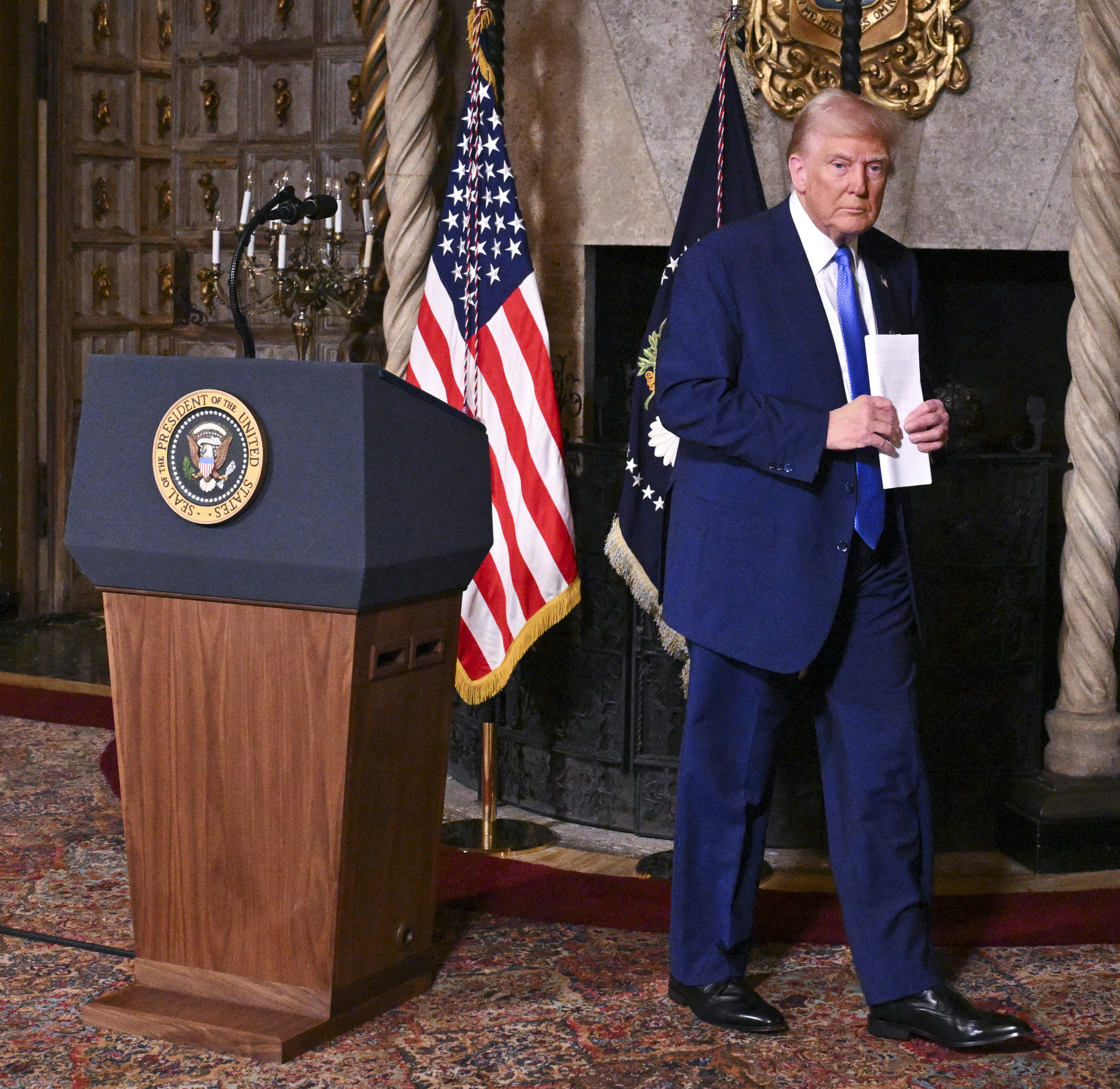 President Donald Trump departs after speaking at Mar-a-Lago in Palm Beach, Fla., Tuesday, Feb. 18, 2025. (Pool via AP)