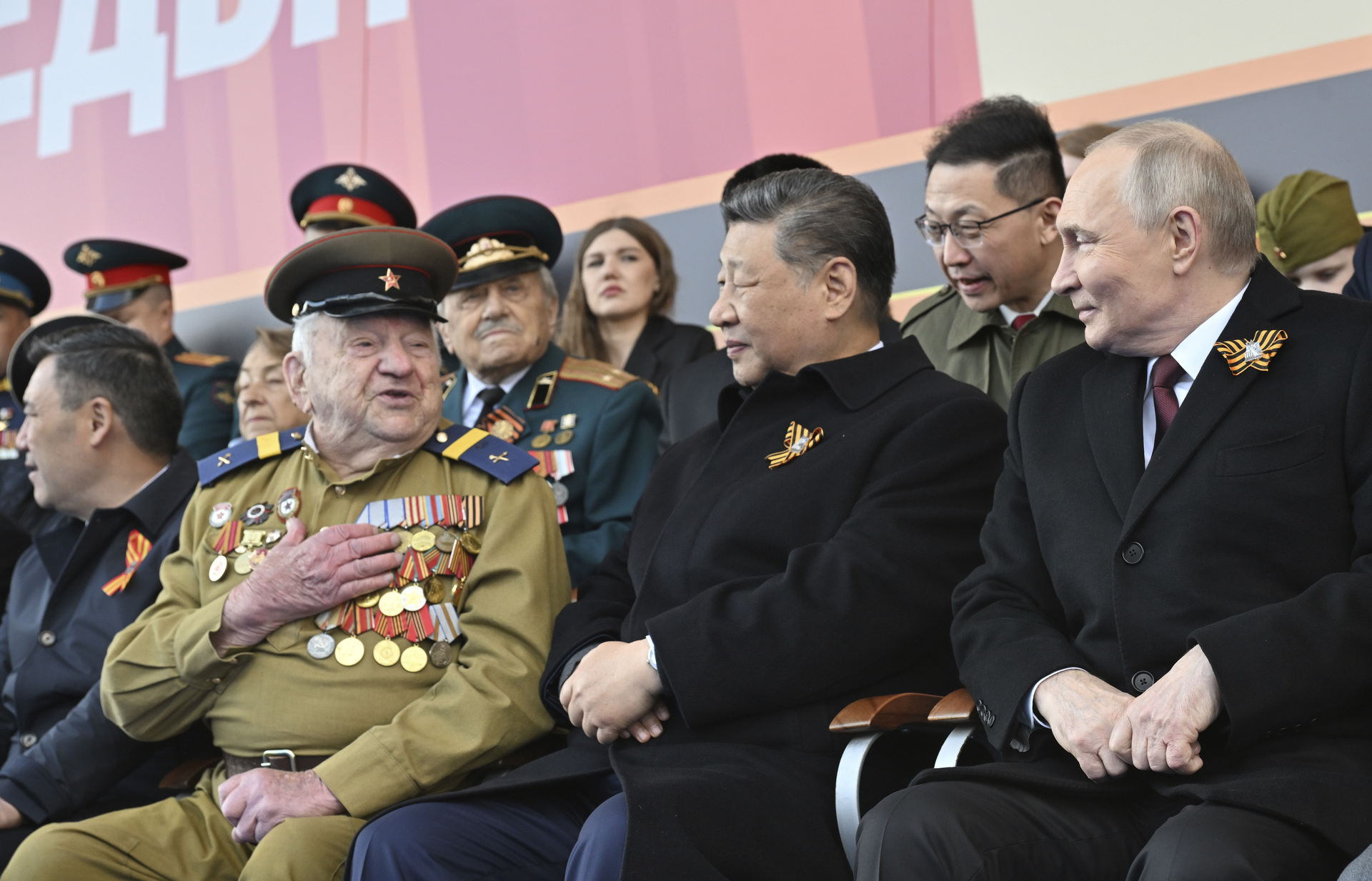 Russian President Vladimir Putin, right, and Chinese President Xi Jinpin, centre, wait for the start of the Victory Day military parade in Moscow, Russia, Friday, May 9, 2025, during celebrations of the 80th anniversary of the Soviet Union's victory over Nazi Germany during the World War II. (Mikhail Korytov/Photo host agency RIA Novosti via AP)