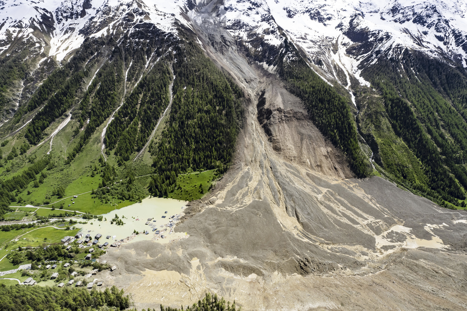 An aerial view shows the destruction of Blatten, Switzerland, Thursday, May 29, 2025, one day after a massive debris avalanche, triggered by the collapse of the Birch Glacier, swept down to the valley floor and demolished large parts of the village. (Jean-Christophe Bott/Keystone via AP)