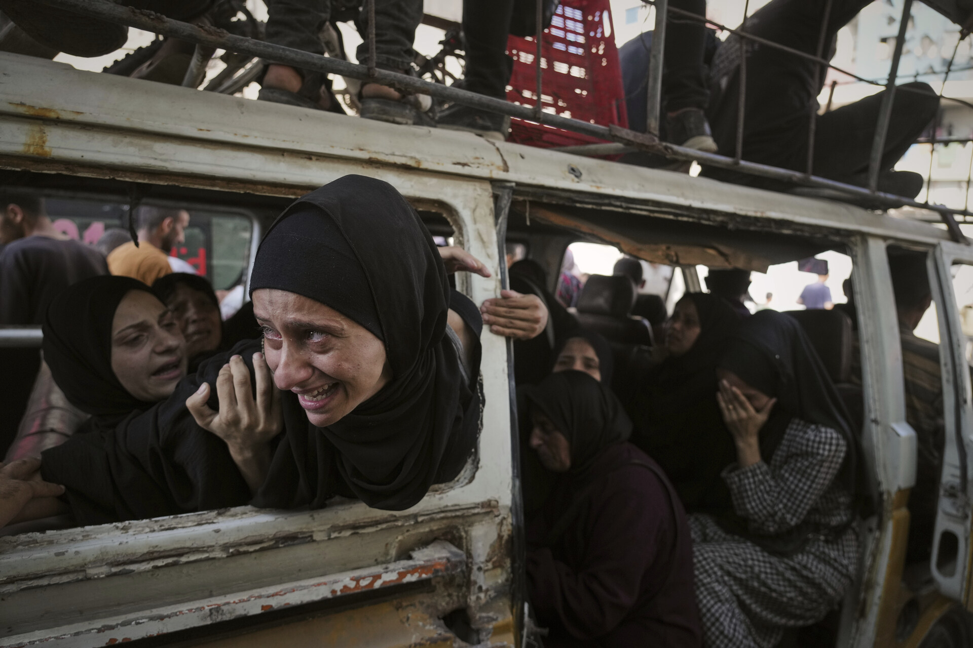 Palestinians mourn their relatives killed from an Israeli army bombardment of Gaza, at Shifa Hospital in Gaza City Tuesday, July 22, 2025. (AP Photo/Jehad Alshrafi)