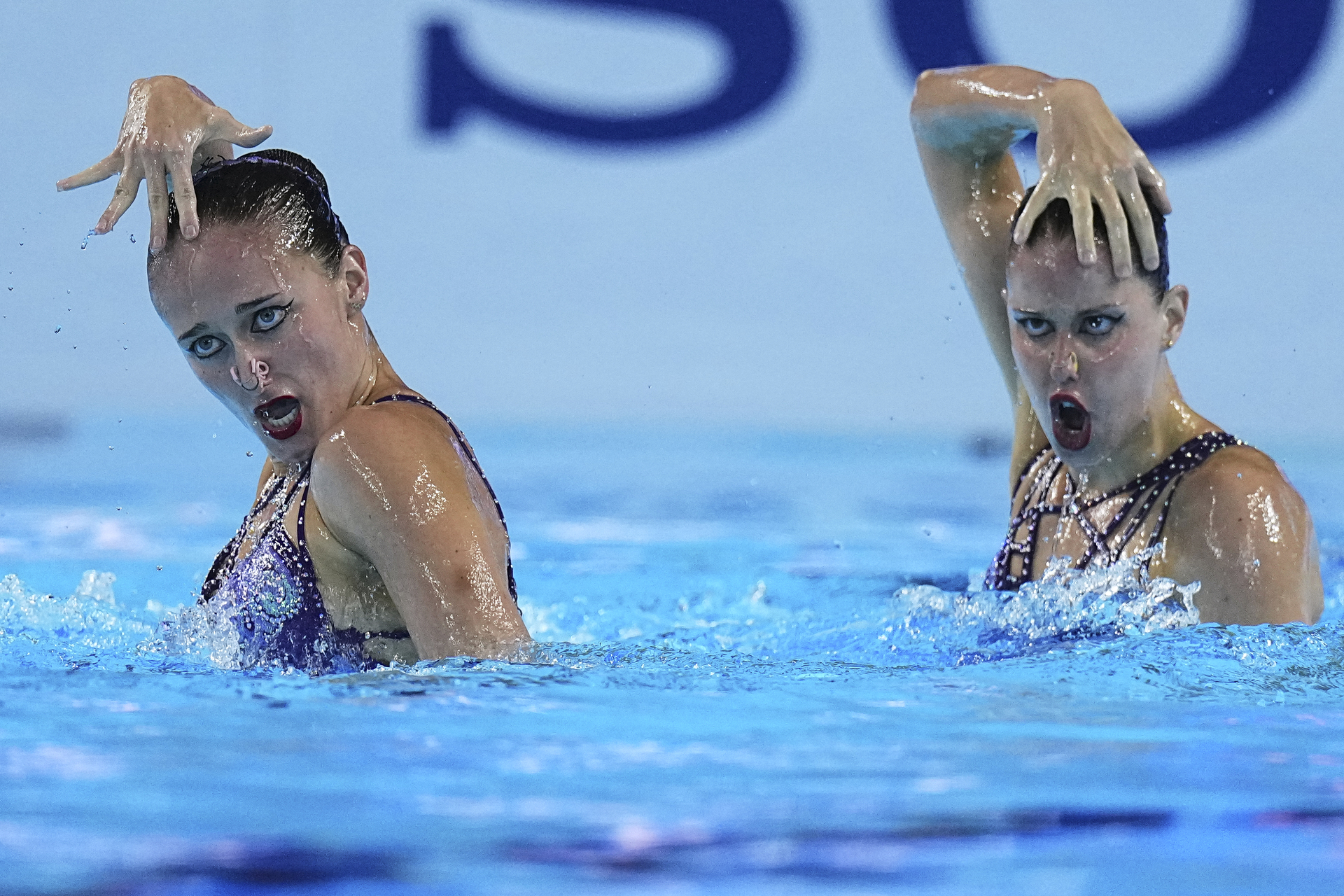 Lilou Lluis Valette and Iris Tio Casas of Spain compete in the women's duet free final of artistic swimming at the World Aquatics Championships in Singapore, Thursday, July 24, 2025. (AP Photo/Ng Han Guan)